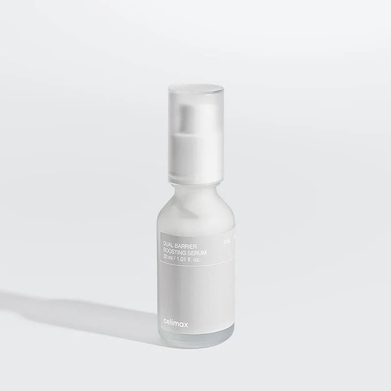Skincare serum bottle with visible brand name on a light gray background