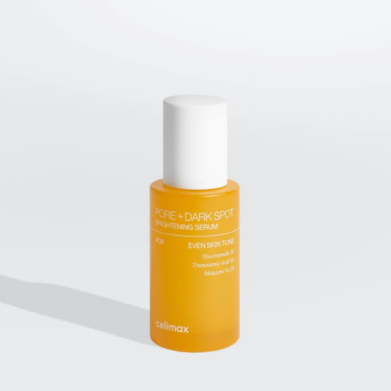 Orange serum bottle with white cap on a light gray background