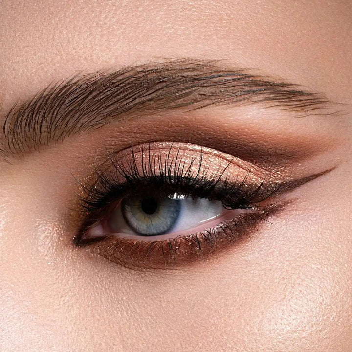 Close-up of a woman's eye with NATASHA DENONA I Need a Warm Eyeshadow Palette makeup