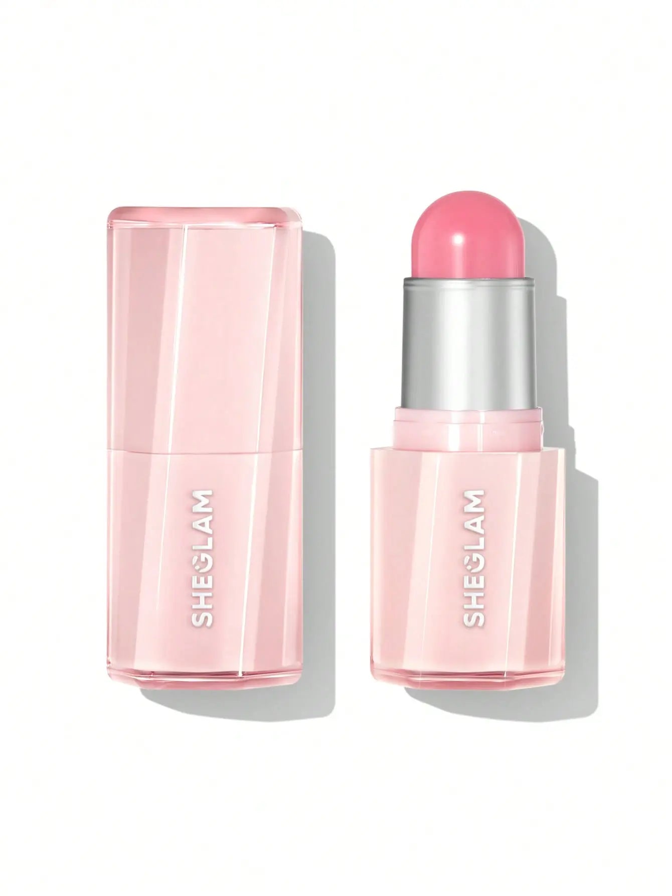 Sheglam Buttery Bliss Blush Stick 6g shade Guava Juice shown next to its matching translucent pink cap on a clean white background.