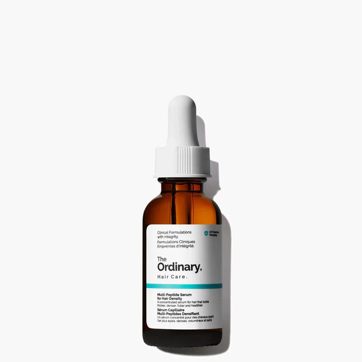 The Ordinary Hair Care Niacin Complex Serum in an amber glass dropper bottle with a white dropper cap and white label, set against a clean white background with a soft shadow.